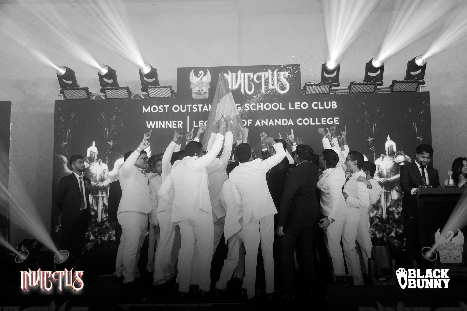 The club celebrating the Most Outstanding School Leo Club win, in black and white